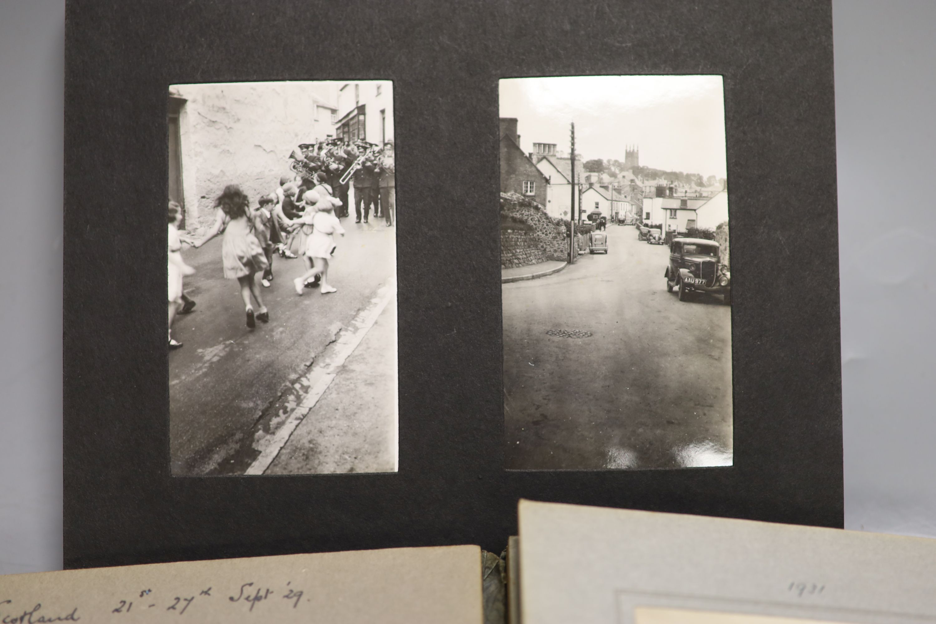 Three albums of photographs and a quantity of postcards inc. erotica.